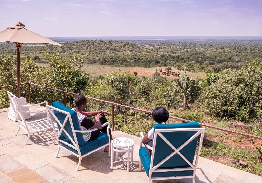 Masai Mara National Reserve, Kenya. Clients viewing wildlife